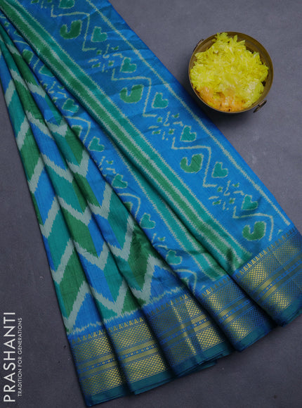 Semi tussar saree green and teal blue with allover zigzag ikat prints and zari woven border