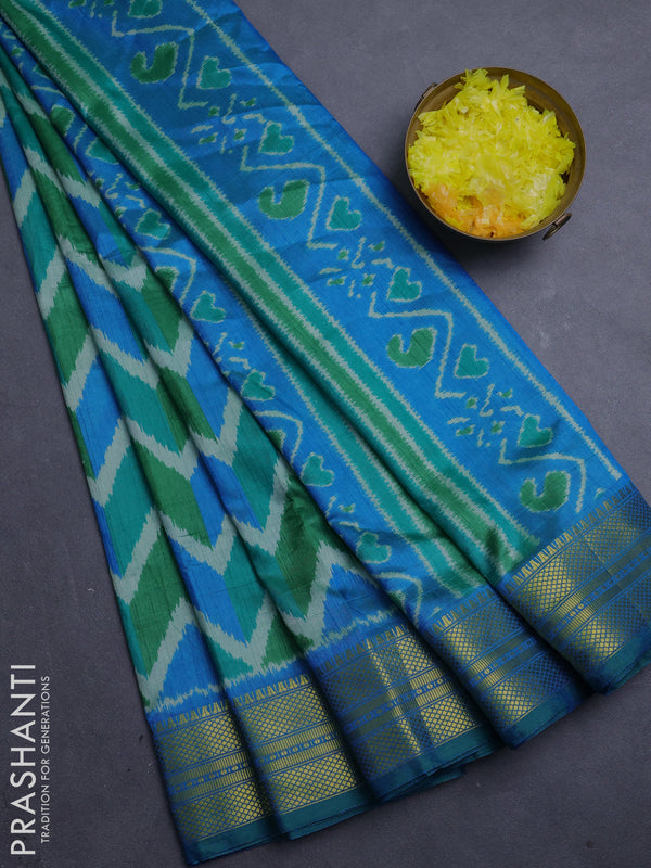 Semi tussar saree green and teal blue with allover zigzag ikat prints and zari woven border