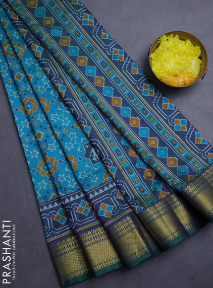 Semi tussar saree teal green and bottle green with allover patola prints and zari woven border