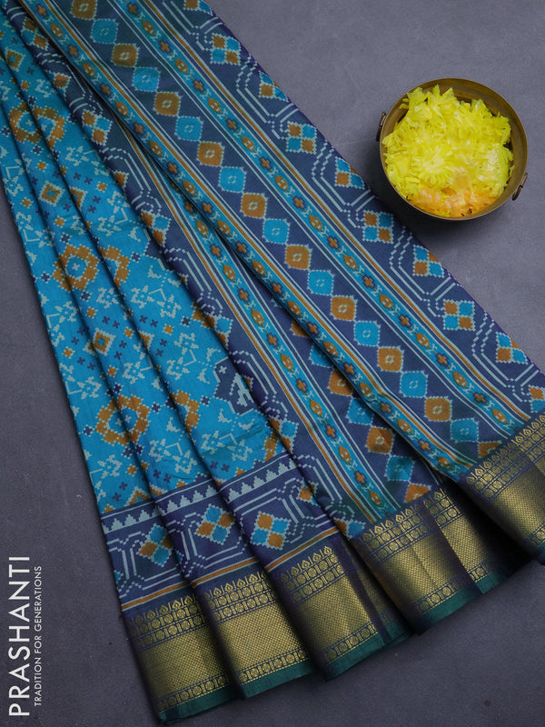 Semi tussar saree teal green and bottle green with allover patola prints and zari woven border