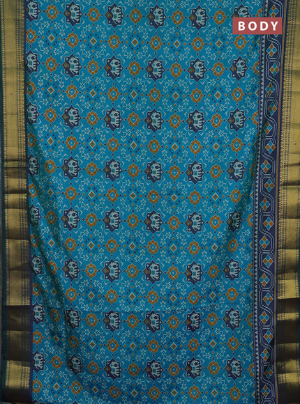 Semi tussar saree teal green and bottle green with allover patola prints and zari woven border