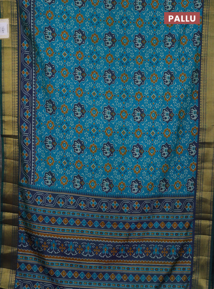 Semi tussar saree teal green and bottle green with allover patola prints and zari woven border