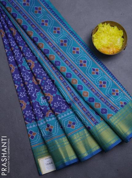 Semi tussar saree blue and teal green with allover patola prints and zari woven border