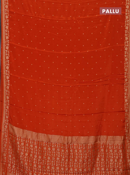 Semi mysore silk saree rustic orange with allover zari woven buttas and zari woven border