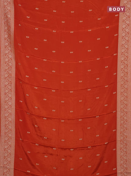 Semi mysore silk saree rustic orange with allover zari woven buttas and long zari woven border