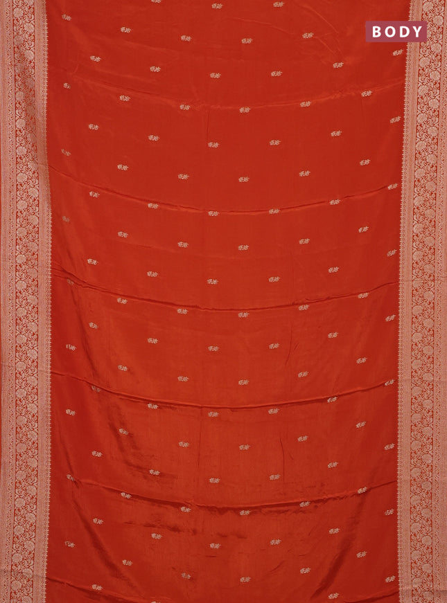 Semi mysore silk saree rustic orange with allover zari woven buttas and long zari woven border