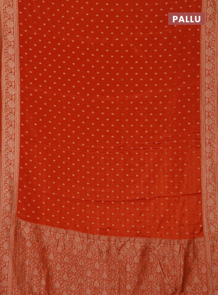 Semi mysore silk saree rust shade with allover zari woven buttas and zari woven border