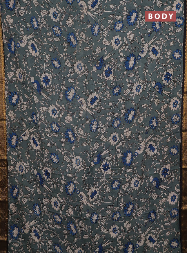 Kalamkari semi silk saree pastel green and black with allover prints and mangalgiri border