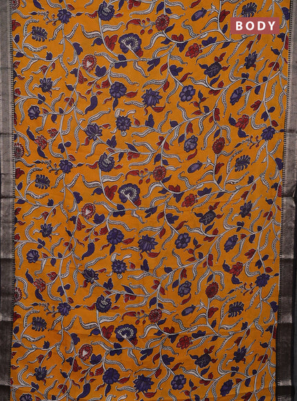 Kalamkari semi silk saree mango yellow and black with allover prints and mangalgiri border