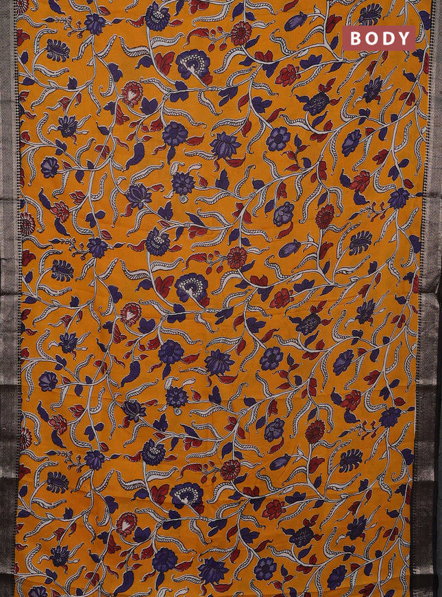 Kalamkari semi silk saree mango yellow and black with allover prints and mangalgiri border