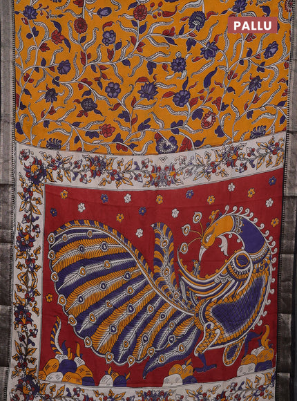 Kalamkari semi silk saree mango yellow and black with allover prints and mangalgiri border