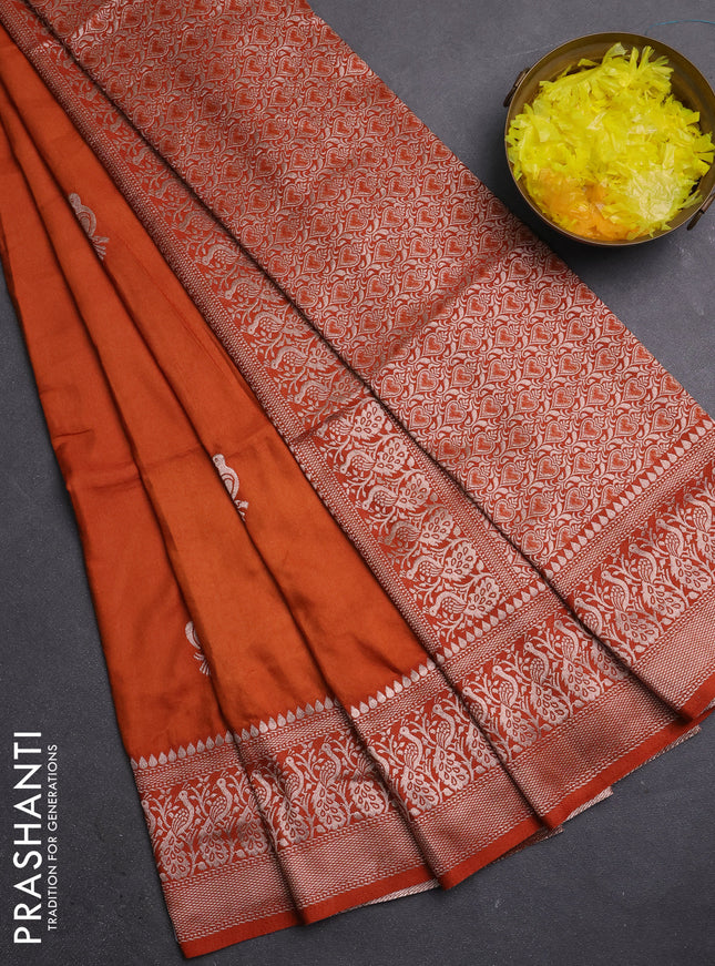 Semi soft silk saree rust shade with zari woven buttas and zari woven border