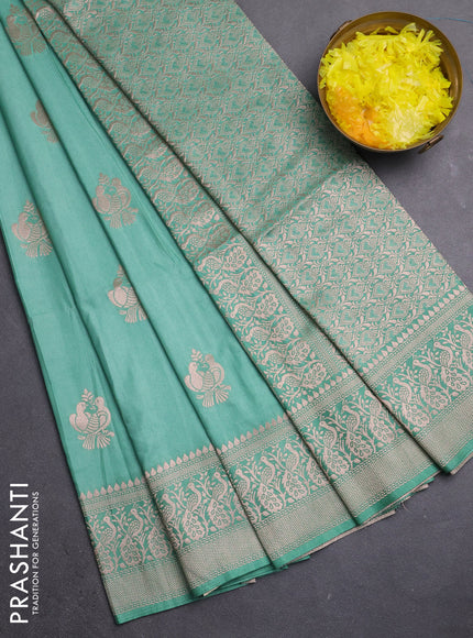 Semi soft silk saree pastel green with zari woven buttas and zari woven border