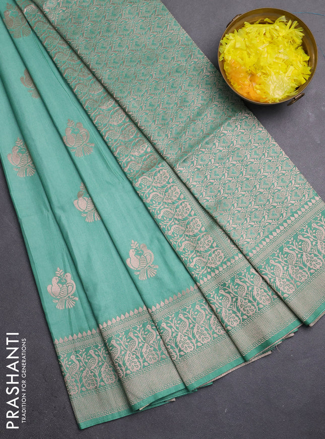 Semi soft silk saree pastel green with zari woven buttas and zari woven border