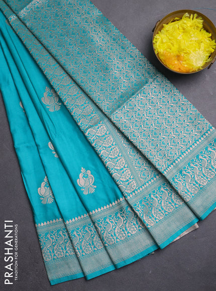 Semi soft silk saree teal blue with zari woven buttas and zari woven border
