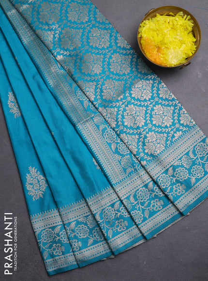 Semi soft silk saree teal blue shade with zari woven buttas and zari woven border