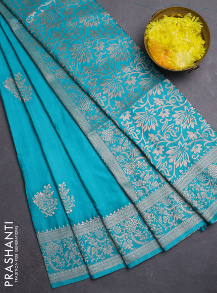 Semi soft silk saree teal green with zari woven buttas and zari woven border