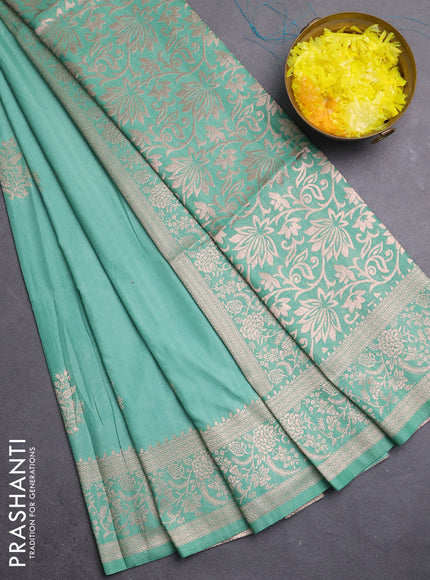 Semi soft silk saree pastel green with zari woven buttas and zari woven border