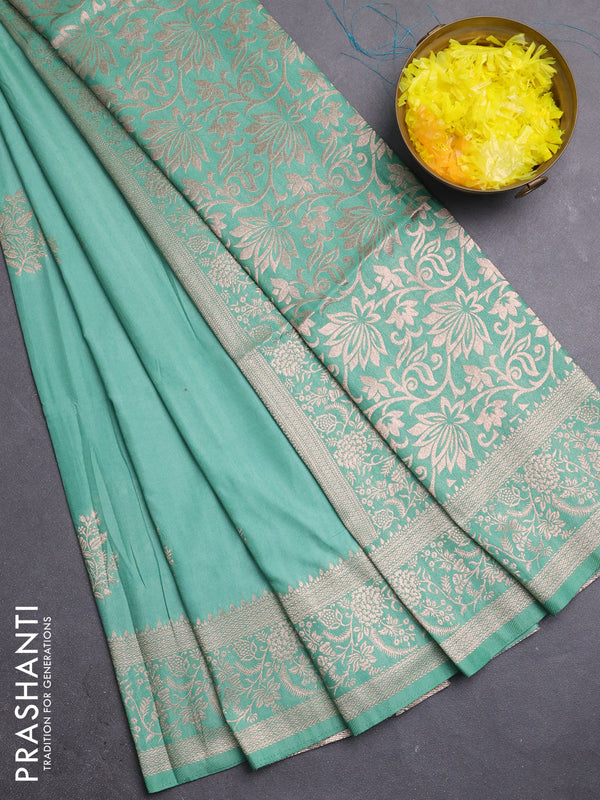 Semi soft silk saree pastel green with zari woven buttas and zari woven border