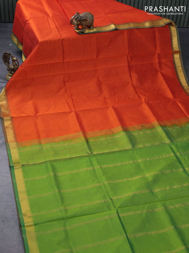 Silk cotton saree rustic orange and green with plain body and small zari woven border