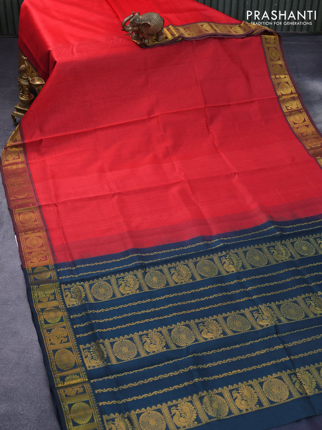 Silk cotton saree red shade and peacock blue with plain body and zari woven annam border