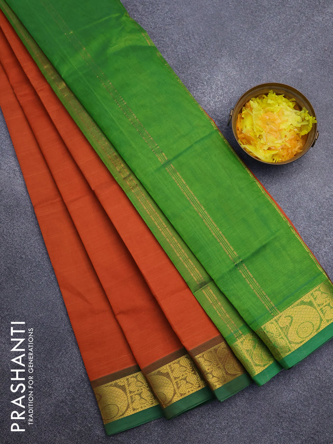 Silk cotton saree rustic orange and green with plain body and paisley zari woven border
