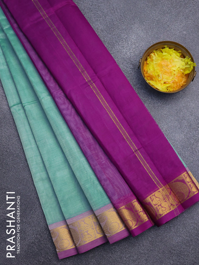 Silk cotton saree teal blue and deep purple with plain body and paisley zari woven border