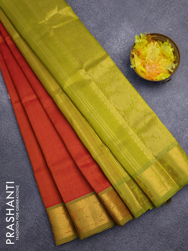 Silk cotton saree sunset orange and light green with plain body and annam zari woven border
