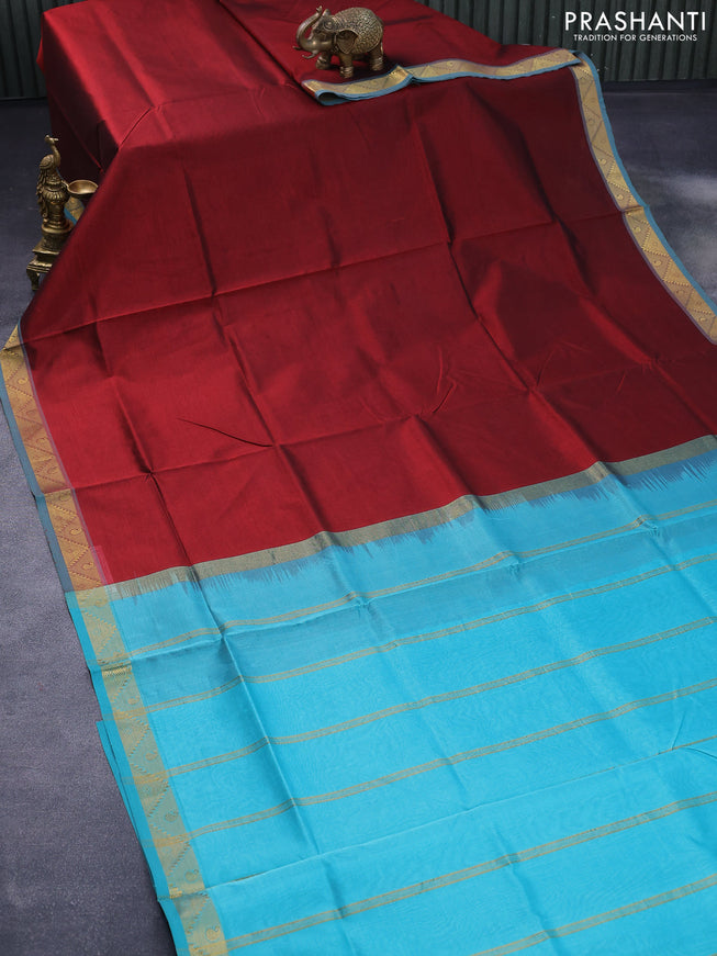 Silk cotton saree maroon and teal blue with plain body and zari woven border