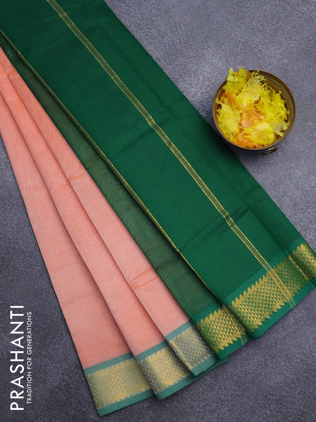 Silk cotton saree pale orange and green with plain body and zari woven border