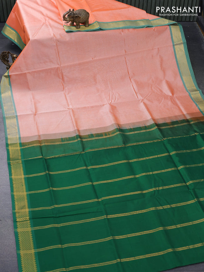 Silk cotton saree pale orange and green with plain body and zari woven border