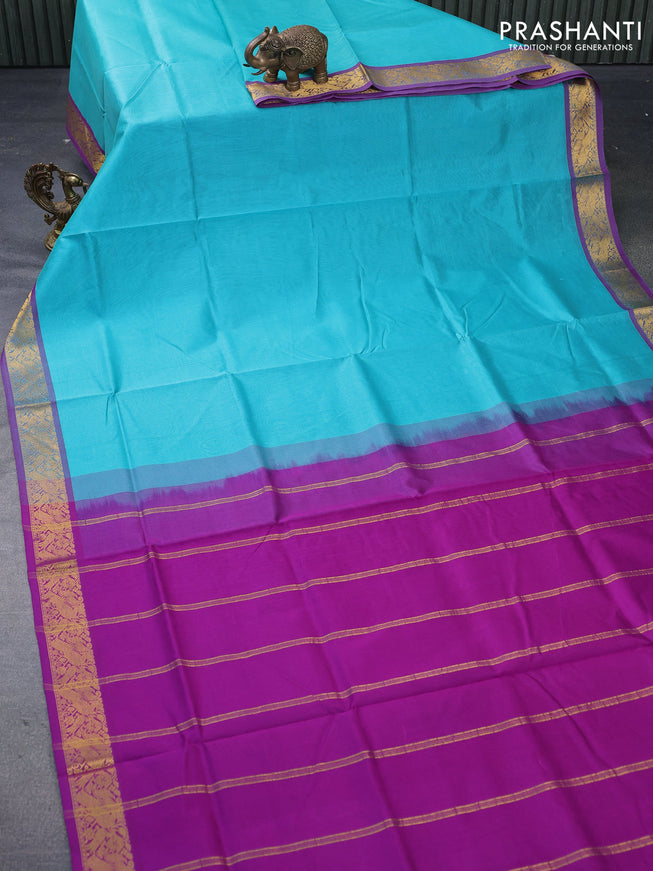Silk cotton saree teal blue and purple with plain body and peacock zari woven border