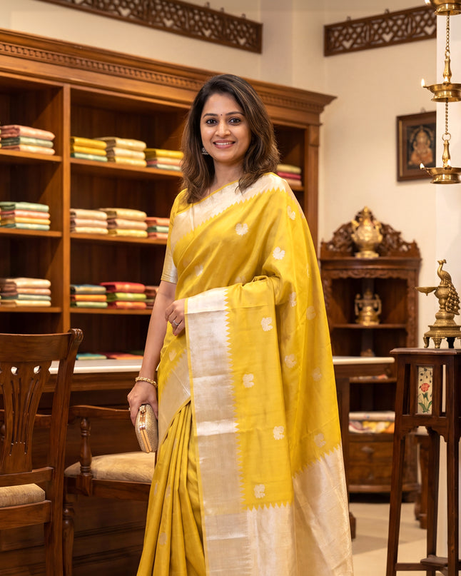 Tissue Kanchipuram silk saree gold with rudhraksha & annam silver zari woven buttas and long silver zari woven border