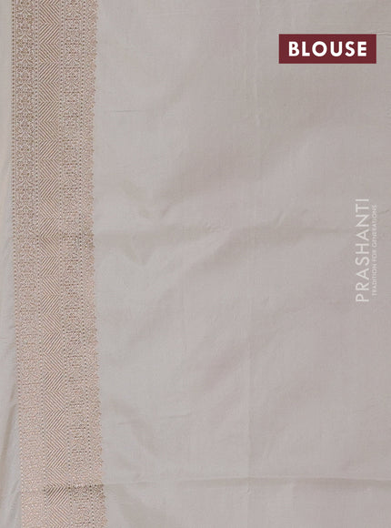 Banarasi uppada silk saree beige with allover floral zari weaves and zari woven border