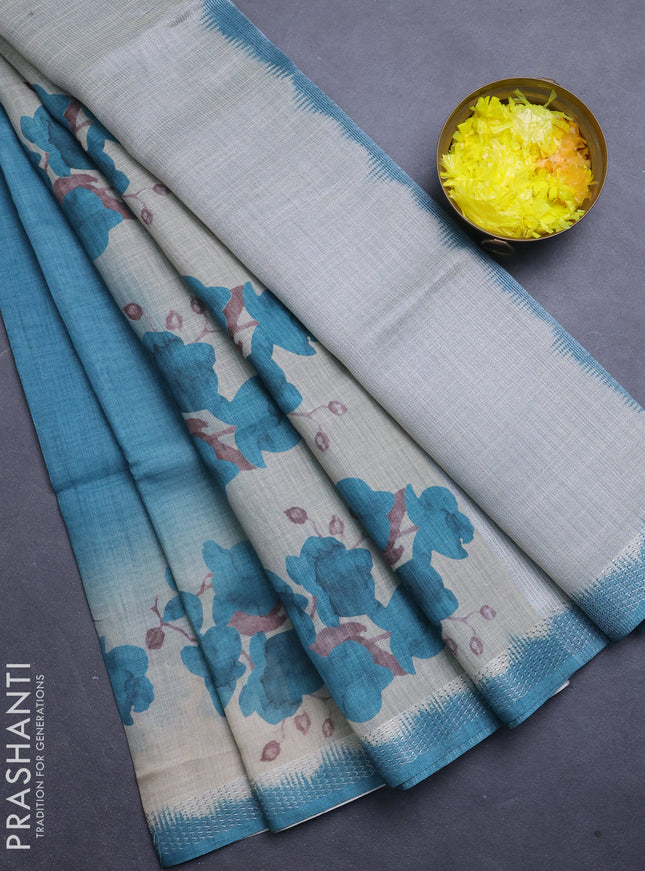 Art linen cotton saree peacock green and beige with plain body and floral printed silver zari woven border