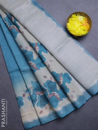 Art linen cotton saree peacock green and beige with plain body and floral printed silver zari woven border