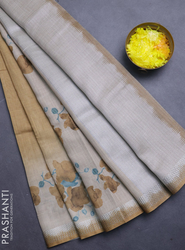 Art linen cotton saree mustard yellow and beige with plain body and floral printed silver zari woven border