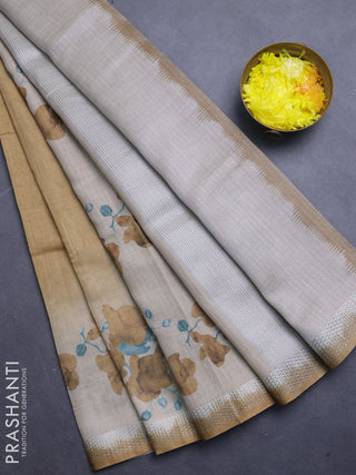 Art linen cotton saree mustard yellow and beige with plain body and floral printed silver zari woven border
