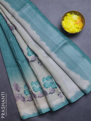 Art linen cotton saree peacock green and beige with plain body and floral printed silver zari woven border