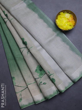 Art linen cotton saree light green and beige with plain body and floral printed silver zari woven border