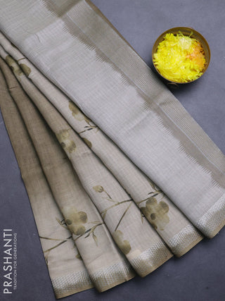 Art linen cotton saree mehendi green and beige with plain body and floral printed silver zari woven border
