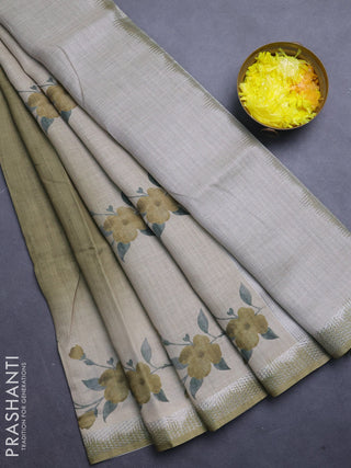 Art linen cotton saree mehendi green and beige with plain body and floral printed silver zari woven border
