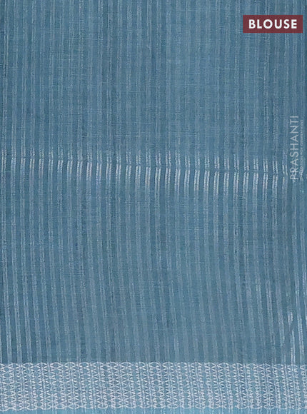 Art linen cotton saree peacock green and beige with plain body and floral printed silver zari woven border