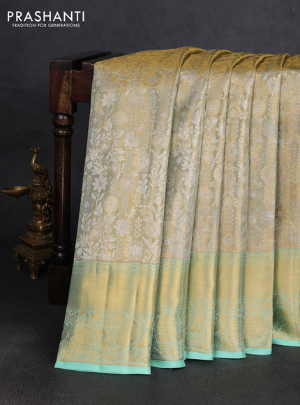 Pure kanchipuram tissue silk saree gold and pista green shade with allover zari woven floral brocade weaves and rich zari woven border