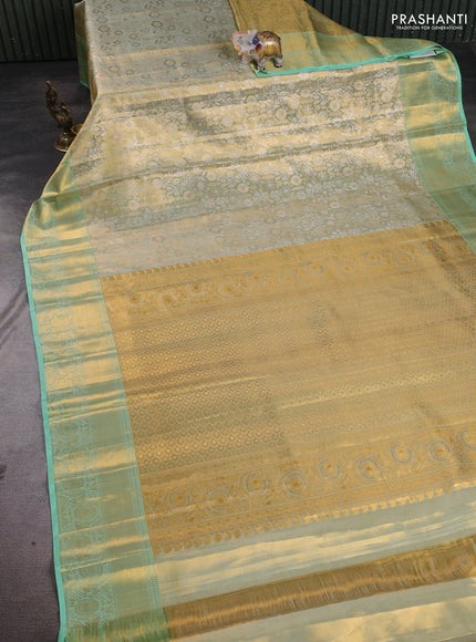 Pure kanchipuram tissue silk saree gold and pista green shade with allover zari woven floral brocade weaves and rich zari woven border