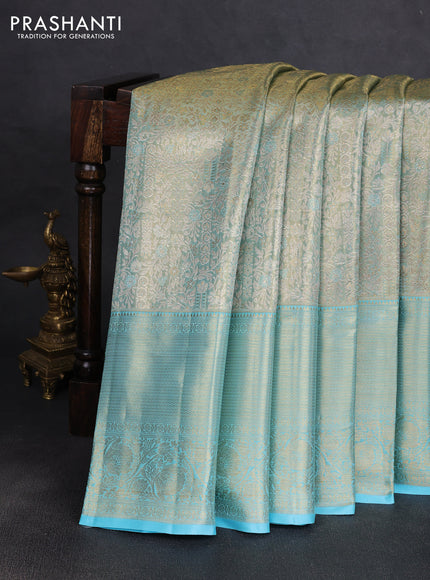 Pure kanchipuram tissue silk saree dual shade of light blue with allover zari woven brocade weaves and rich zari woven border