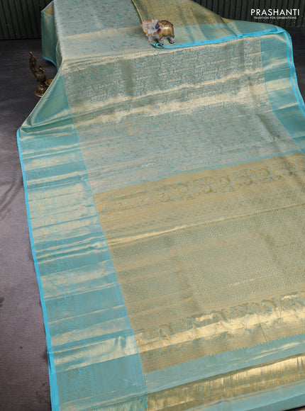 Pure kanchipuram tissue silk saree dual shade of light blue with allover zari woven brocade weaves and rich zari woven border