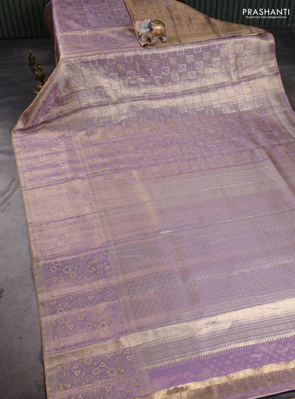 Pure kanchipuram tissue silk saree dual shade of lavender with alllover zari woven floral brocade weaves and zari woven border