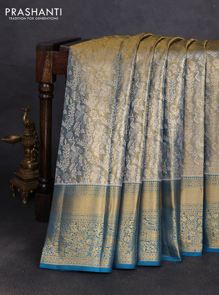 Pure kanchipuram tissue silk saree dual shade of pista green and peacock green with alllover zari woven peacock brocade weaves and rich zari woven border