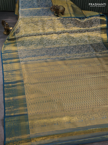 Pure kanchipuram tissue silk saree dual shade of pista green and peacock green with alllover zari woven peacock brocade weaves and rich zari woven border